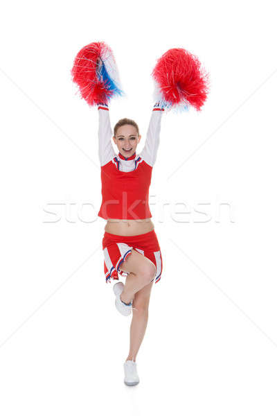 Young Cheerleader Holding Pom-poms Stock photo © AndreyPopov