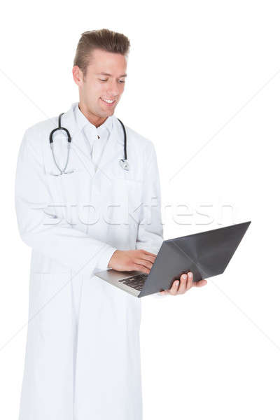 Foto d'archivio: Felice · giovani · medico · di · sesso · maschile · laptop · bianco