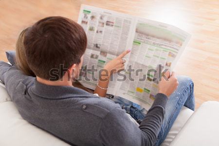 Woman reading the newspaper Stock photo © AndreyPopov