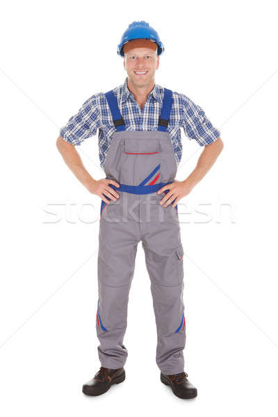 Manual Worker Standing With Hands On Hip Stock photo © AndreyPopov