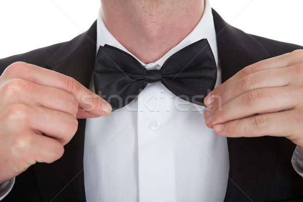 Midsection Of Waiter Adjusting Bowtie Stock photo © AndreyPopov