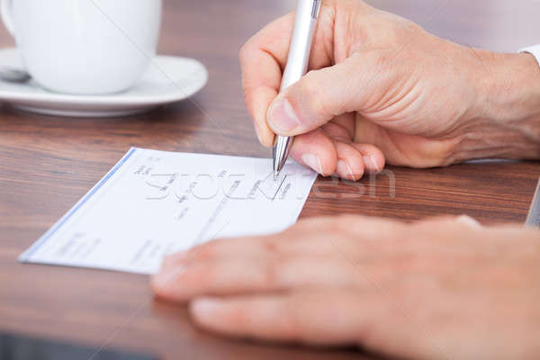 Filling Out The Amount On A Cheque Stock photo © AndreyPopov