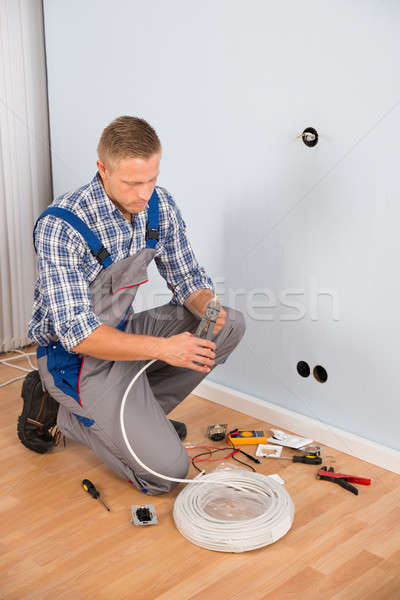 Electrician Working With Wire With Plier Stock photo © AndreyPopov