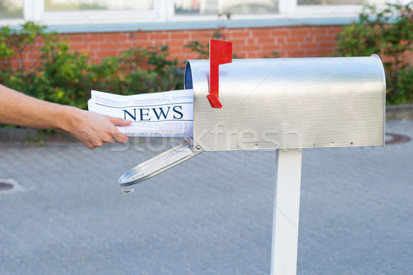 Stock photo: Person Hands Opening Mailbox To Remove Newspaper