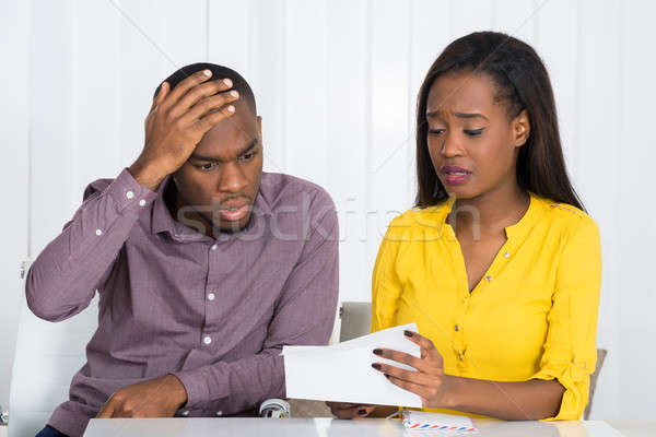 Sad Couple Looking At Bill Stock photo © AndreyPopov