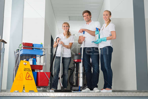 Portrait Of Janitors Holding Cleaning Equipments Stock photo © AndreyPopov