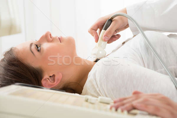 Woman Gets Ultrasound Of The Thyroid From Doctor Stock photo © AndreyPopov