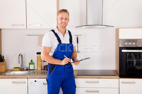 Portrait Of A Technician In Kitchen Stock photo © AndreyPopov
