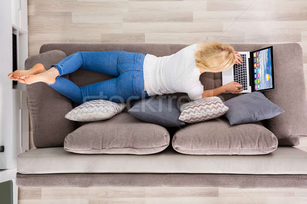Ansicht Frau mit Laptop Couch Computer Stock foto © AndreyPopov