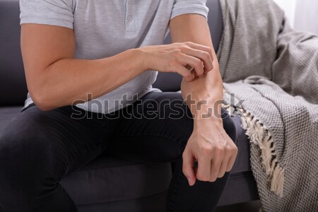 Man Touching Woman's Knee Stock photo © AndreyPopov