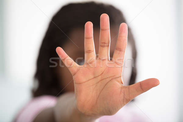 Stock photo: Girl Showing Stop Sign