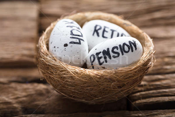 Pension  401K And Retire Written On White Eggs In Nest Stock photo © AndreyPopov