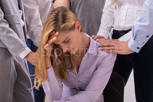 Stock photo: People Consoling Unhappy Woman