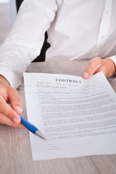 Stock photo: Businessman's Hand Holding Pen And Contract