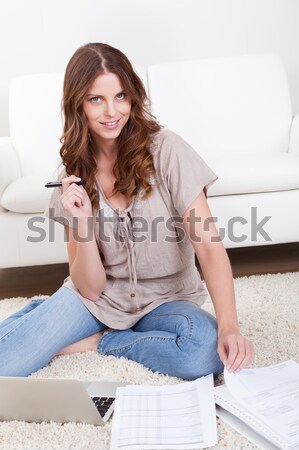 Casual woman sitting on a couch Stock photo © AndreyPopov