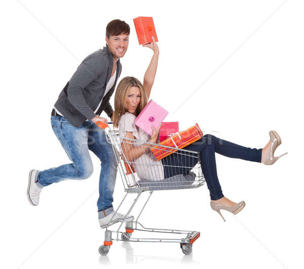 Woman carried by push cart Stock photo © AndreyPopov