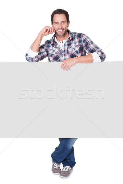 Happy middle age man presenting empty banner Stock photo © AndreyPopov