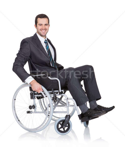 Young businessman in wheelchair Stock photo © AndreyPopov