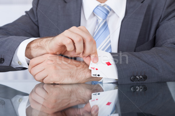 Businessperson Removing Ace From The Sleeve Stock photo © AndreyPopov