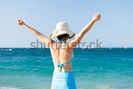 Woman With Sarong Running On Beach Stock photo © AndreyPopov