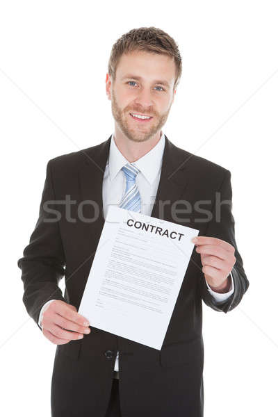 Confident Businessman Holding Contract Paper Stock photo © AndreyPopov