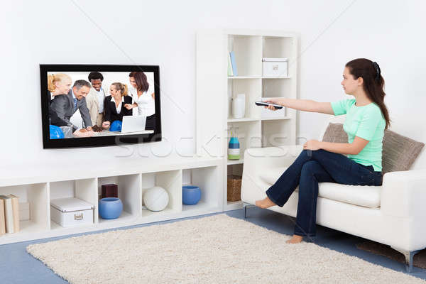 Woman Watching Television Stock photo © AndreyPopov