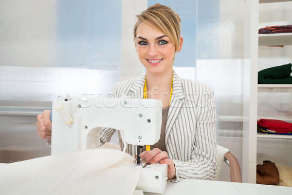 Beautiful Fashion Designer Working On Sewing Machine Stock photo © AndreyPopov