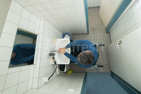 Disabled Man In Bathroom Washing Hands Stock photo © AndreyPopov