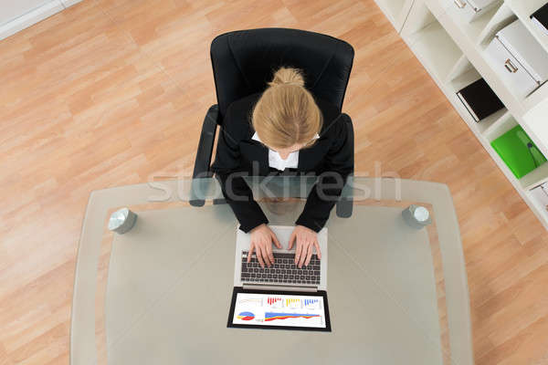 Businesswoman Working On Financial Data With Laptop Stock photo © AndreyPopov