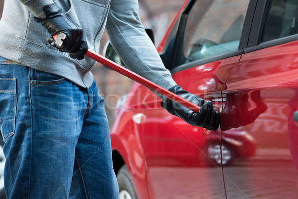 Thief Opening Car's Door With Crowbar Stock photo © AndreyPopov