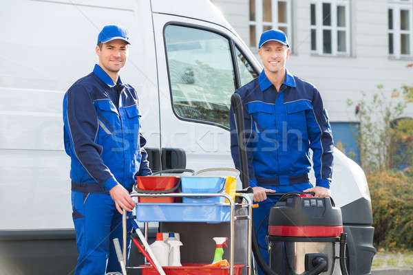 Happy Janitors Standing Against Truck Stock photo © AndreyPopov