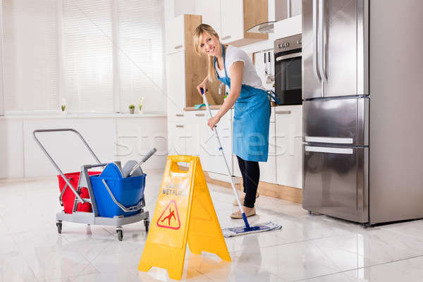 Woman Cleaning Kitchen Floor With Mop Stock Photo C Andreypopov 7781991 Stockfresh