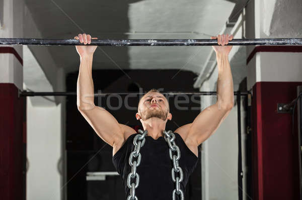 Homem horizontal bar atleta metal Foto stock © AndreyPopov