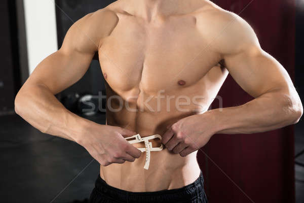 Person Measuring His Body Fat With Caliper Stock photo © AndreyPopov