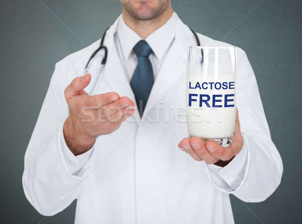 Doctor Holding Lactose Free Glass Of Milk Stock photo © AndreyPopov