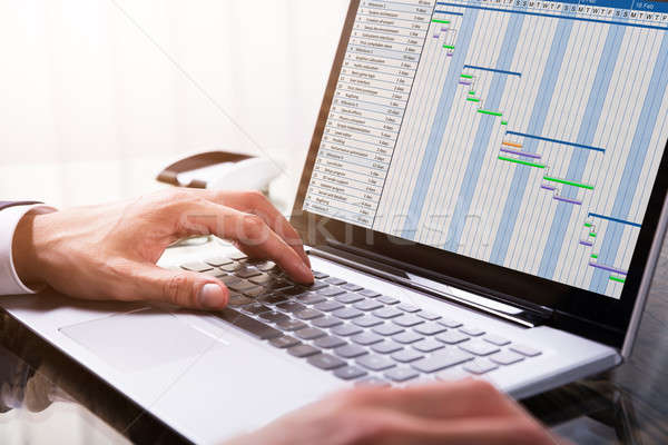 üzletember diagram laptop közelkép kéz munkahely Stock fotó © AndreyPopov