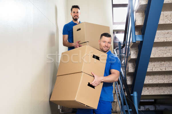 Zwei tragen Karton Boxen Treppe jungen Stock foto © AndreyPopov