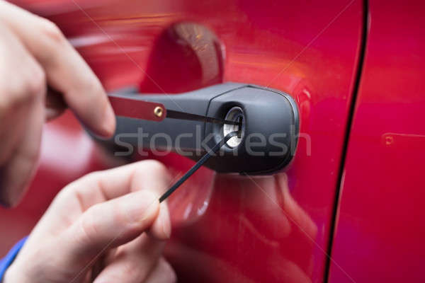 Human Hand Opening Car's Door With Lockpicker Stock photo © AndreyPopov