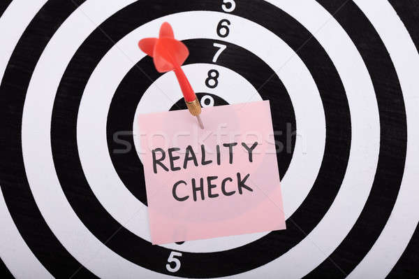Dart And Arrow With Reality Check Word On Sticky Note Stock photo © AndreyPopov