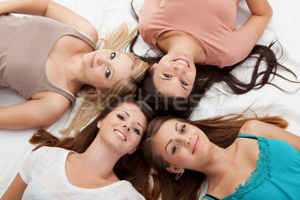 Faces of four attractive girls Stock photo © AndreyPopov