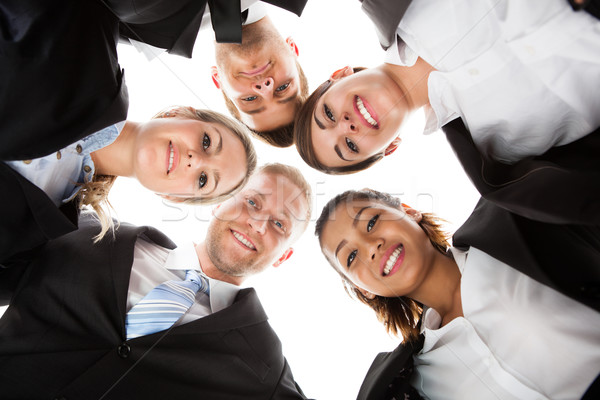 Portrait Of Business People Forming Huddle Stock photo © AndreyPopov