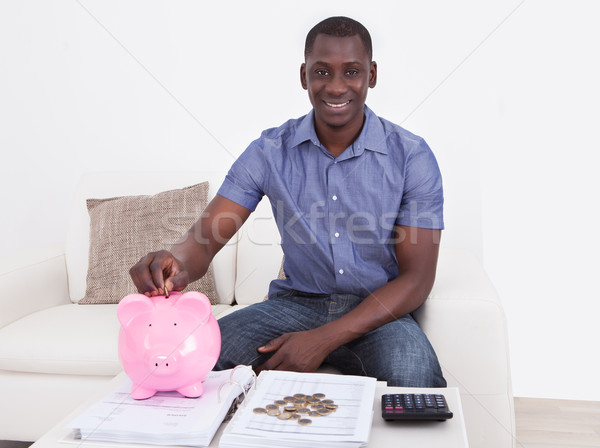 Man With Document And Piggybank Stock photo © AndreyPopov