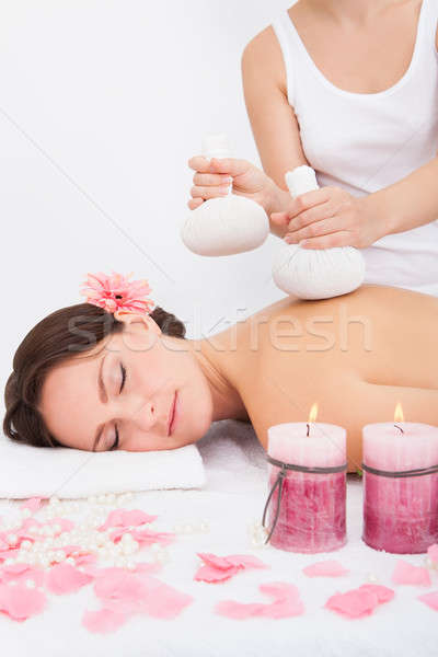 Woman Getting Herbal Compress Ball Therapy Stock photo © AndreyPopov