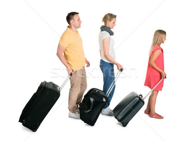 Foto stock: Jóvenes · familia · caminando · equipaje · aislado · blanco