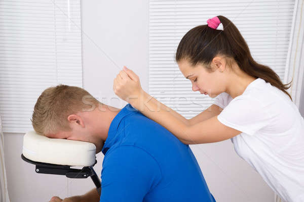 Stock photo: Man Being Massaged By A Physiotherapist