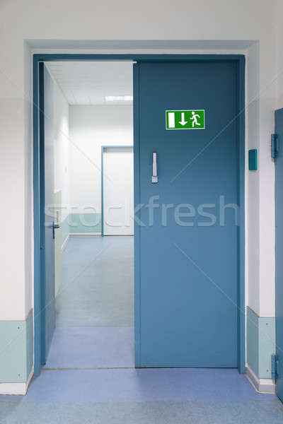 Emergency Evacuation Sign On Door Stock photo © AndreyPopov