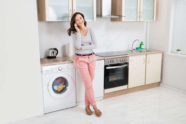 Woman Talking On Mobile Phone Stock photo © AndreyPopov