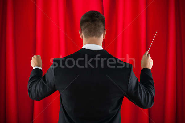 Orchestra Conductor Directing With His Baton Stock photo © AndreyPopov