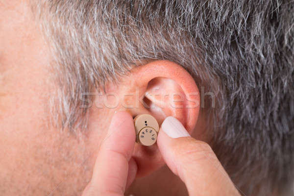 Man Wearing Hearing Aid Stock photo © AndreyPopov