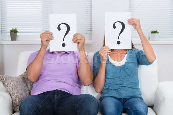 Couple Hiding Face With Question Mark Sign Stock photo © AndreyPopov